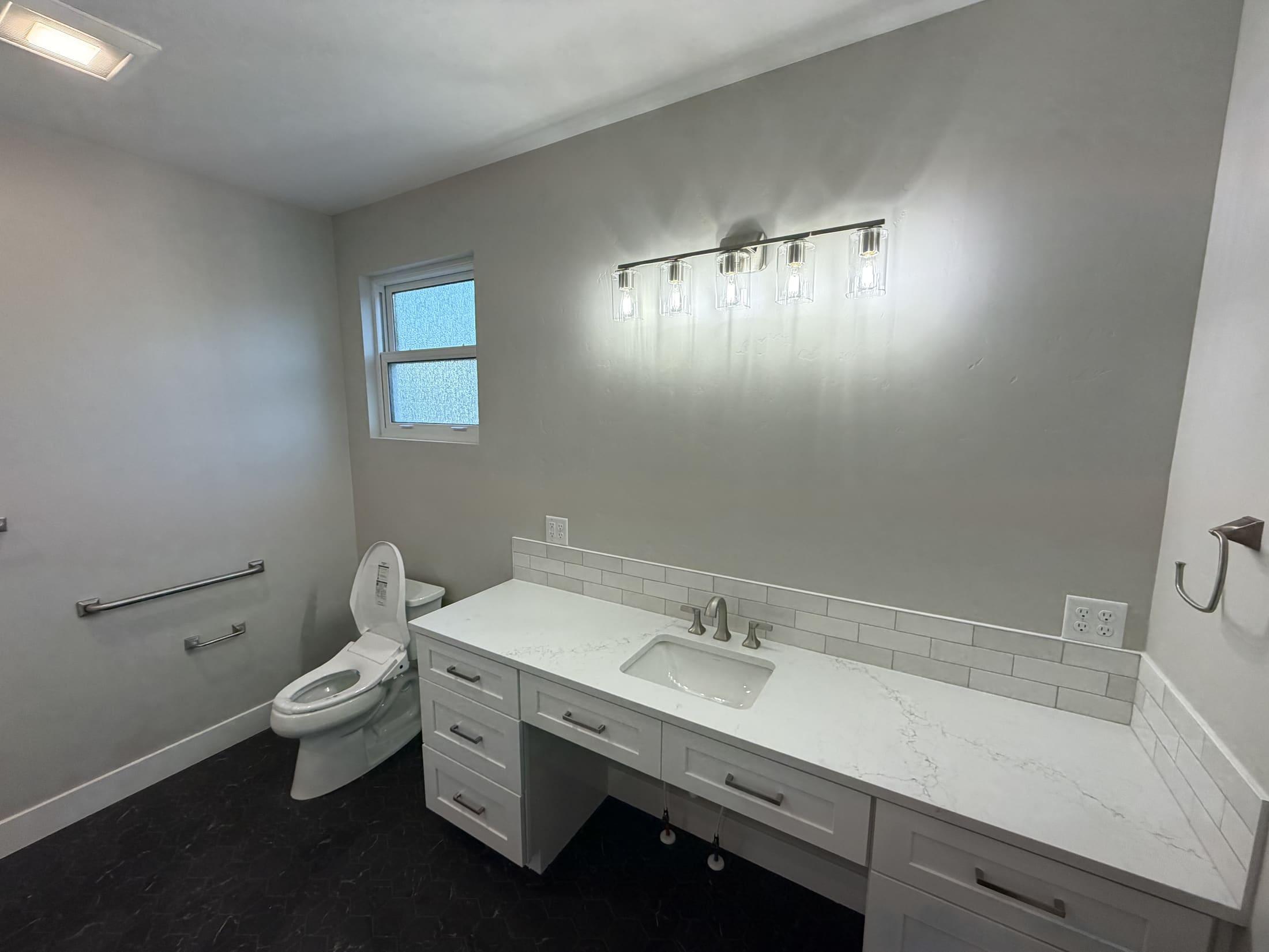 ADA friendly bathroom with curbless shower